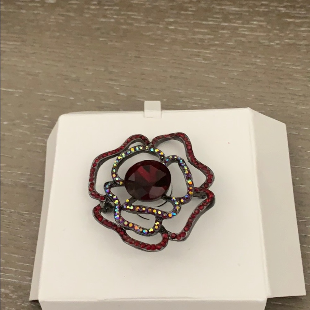 Red and silver brooche